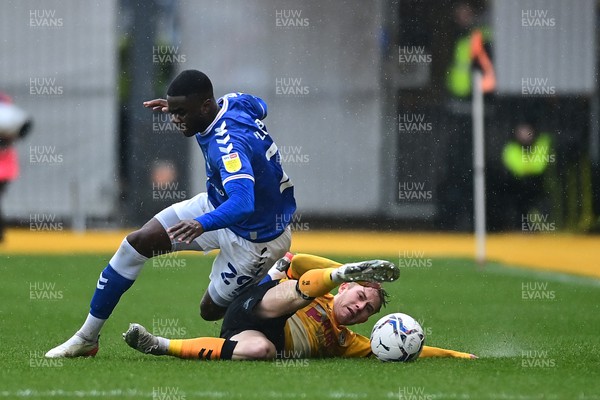 120222 - Newport County v Oldham Athletic - Sky Bet League 2 - Junior Luamba of Oldham Athletic is tackled by Oli Cooper of Newport County 