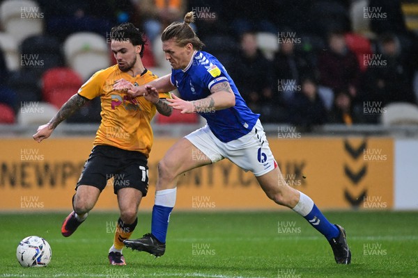 120222 - Newport County v Oldham Athletic - Sky Bet League 2 - Dom Telford of Newport County under pressure from Carl Piergianni of Oldham Athletic 