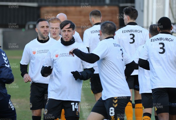 191220 - Newport County v Oldham Athletic, Sky Bet League 2 - Newport County players warm up wearing T-shirts showing support for former manager's Justin Edinburgh 3 Foundation