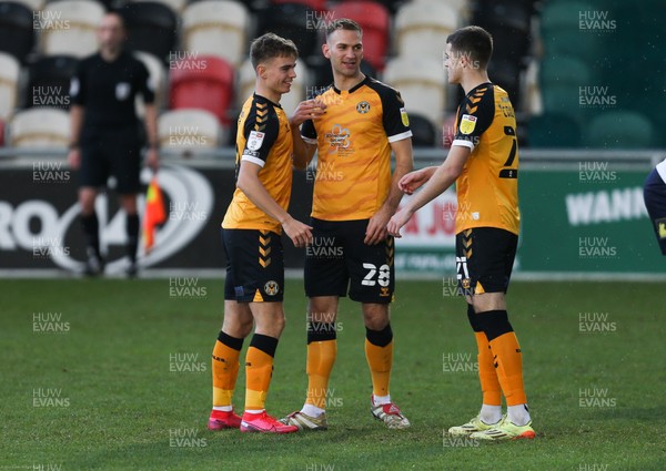 191220 - Newport County v Oldham Athletic, Sky Bet League 2 - Scott Twine of Newport County is congratulated by Mickey Demetriou of Newport County and Lewis Collins of Newport County after scoring goal