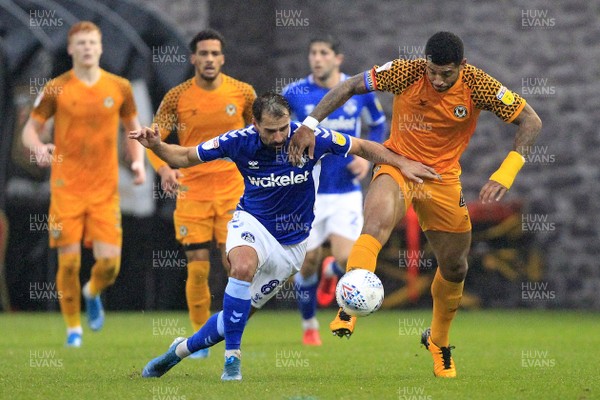 231119 - Newport County v Oldham Athletic, Sky Bet League 2 - Joss Labadie of Newport County (right) and Filipe Morais of Oldham Athletic battle for the ball