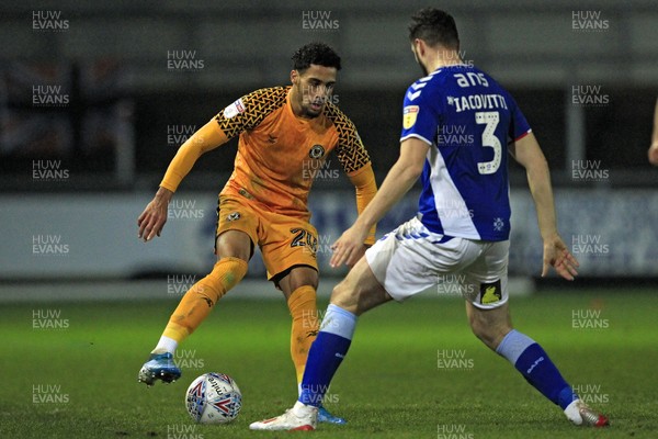 231119 - Newport County v Oldham Athletic, Sky Bet League 2 - Corey Whitely of Newport County (left) in action with Alex Iacovitti of Oldham Athletic