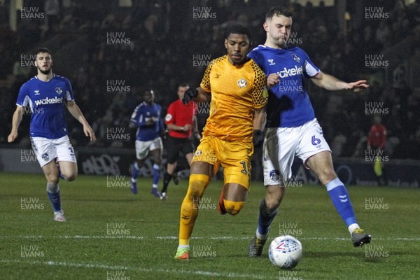 231119 - Newport County v Oldham Athletic, Sky Bet League 2 -Tristan Abrahams of Newport County (left) in action with Jamie Stott of Oldham Athletic