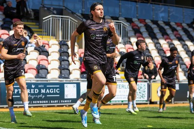 250426 - Newport County v Oldham Athletic - Sky Bet League 2 - Anthony Driscoll-Glennon of Newport County warming up before game