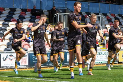 250426 - Newport County v Oldham Athletic - Sky Bet League 2 - Newport County players warming up before game