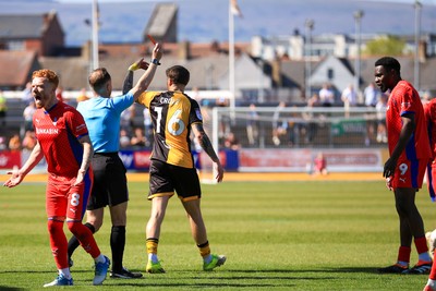 250426 - Newport County v Oldham Athletic - Sky Bet League 2 - Mike Fondop of Oldham Athletic Sent Off shown the red card by referee David Rock