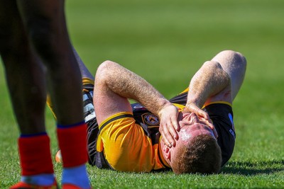 250426 - Newport County v Oldham Athletic - Sky Bet League 2 - Lee Jenkins of Newport County after Mike Fondop of Oldham Athletic challenge