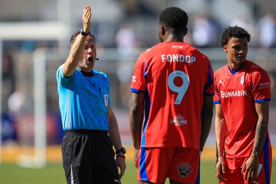 250426 - Newport County v Oldham Athletic - Sky Bet League 2 - Mike Fondop of Oldham Athletic Sent Off shown the red card by referee David Rock