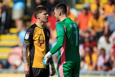 250426 - Newport County v Oldham Athletic - Sky Bet League 2 - James Crole of Newport County and Mathew Hudson of Oldham Athletic