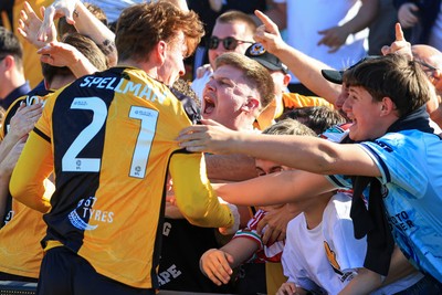 250426 - Newport County v Oldham Athletic - Sky Bet League 2 - Michael Spellman of Newport County celebrates with fans