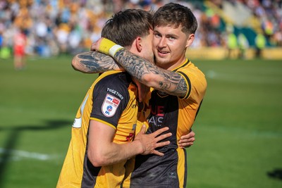 250426 - Newport County v Oldham Athletic - Sky Bet League 2 - Newport players celebrate at full time