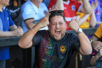 250426 - Newport County v Oldham Athletic - Sky Bet League 2 - Newport County fan celebrates at full time