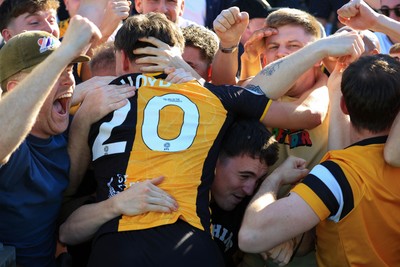 250426 - Newport County v Oldham Athletic - Sky Bet League 2 - Ben Lloyd of Newport County celebrates with fans