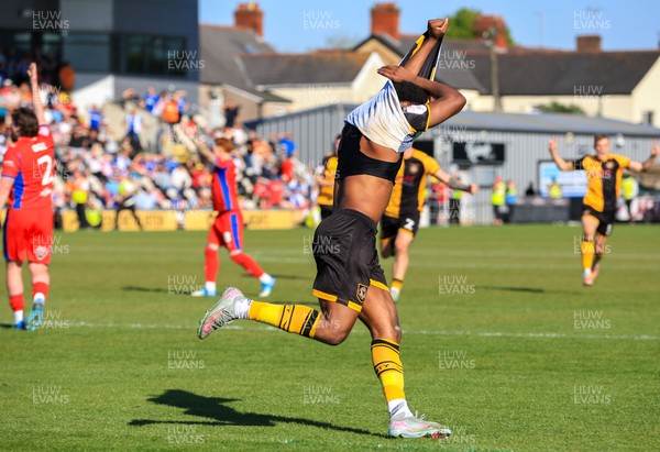 250426 - Newport County v Oldham Athletic - Sky Bet League 2 - Bobby Kamwa of Newport County celebrates after scoring in the 18th minute of injury time at the end of the match