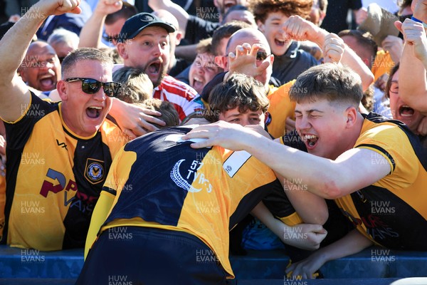 250426 - Newport County v Oldham Athletic - Sky Bet League 2 - Fans celebrate Newport scoring in the 18th minute of injury time to win the match 