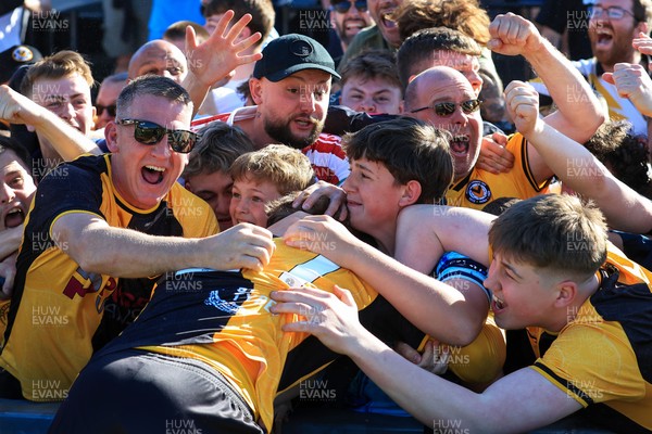 250426 - Newport County v Oldham Athletic - Sky Bet League 2 - Fans celebrate Newport scoring in the 18th minute of injury time to win the match