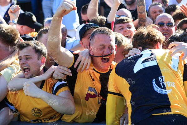 250426 - Newport County v Oldham Athletic - Sky Bet League 2 - Fans celebrate Newport scoring in the 18th minute of injury time to win the match