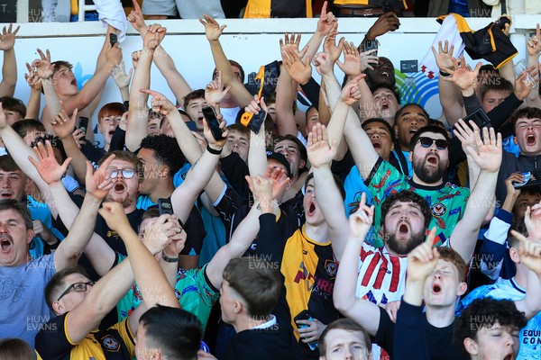 250426 - Newport County v Oldham Athletic - Sky Bet League 2 - Fans celebrate Newport scoring in the 18th minute of injury time to win the match