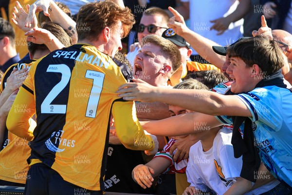 250426 - Newport County v Oldham Athletic - Sky Bet League 2 - Michael Spellman of Newport County celebrates with fans
