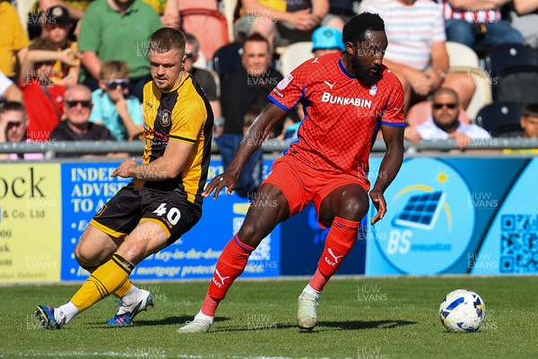 250426 - Newport County v Oldham Athletic - Sky Bet League 2 - Cole Jarvis of Newport County and Dynel Simeu of Oldham Athletic