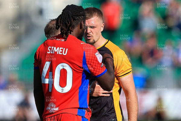 250426 - Newport County v Oldham Athletic - Sky Bet League 2 - Cole Jarvis of Newport County and Dynel Simeu of Oldham Athletic