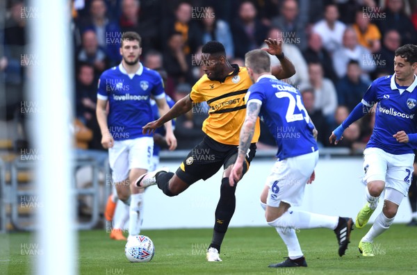 300419 - Newport County v Oldham Athletic - SkyBet League 2 - Jamille Matt of Newport County tries to shoot past Peter Clarke of Oldham Athletic
