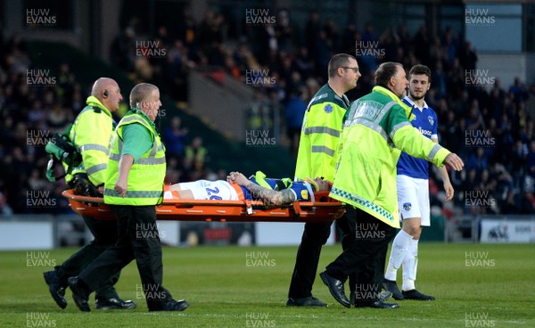 300419 - Newport County v Oldham Athletic - SkyBet League 2 - Peter Clarke of Oldham Athletic is stretchered off after injury
