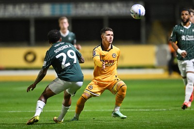 061026 - Newport County v Plymouth Argyle - EFL Trophy - Kieron Evans of Newport County is challenged by Matthew Sorinola of Plymouth