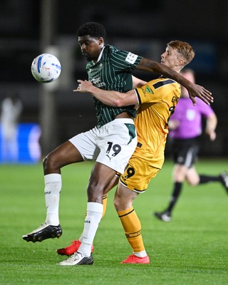 061026 - Newport County v Plymouth Argyle - EFL Trophy - Ged Garner of Newport County is challenged by Tyreeq Bakinson of Plymouth