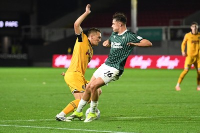 061026 - Newport County v Plymouth Argyle - EFL Trophy - Matt Smith of Newport County is tackled by Tegan Finn of Plymouth in the box and wins his side a penalty