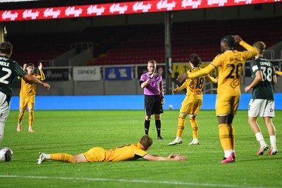 061026 - Newport County v Plymouth Argyle - EFL Trophy - Matt Smith of Newport County is tackled by Tegan Finn of Plymouth in the box and wins his side a penalty