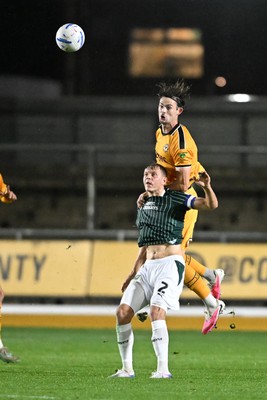 061026 - Newport County v Plymouth Argyle - EFL Trophy - Daniel Sassi of Newport County is challenged by Mathias Ross of Plymouth