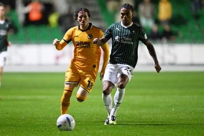 061026 - Newport County v Plymouth Argyle - EFL Trophy - Adam Lewis of Newport County is challenged by Caleb Roberts of Plymouth