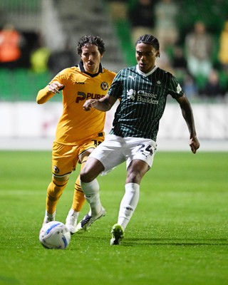 061026 - Newport County v Plymouth Argyle - EFL Trophy - Adam Lewis of Newport County is challenged by Caleb Roberts of Plymouth