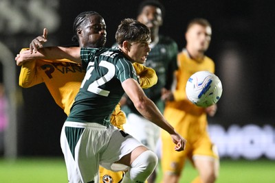 061026 - Newport County v Plymouth Argyle - EFL Trophy - Yahya Bamba of Newport County is challenged by Jared Rendle of Plymouth