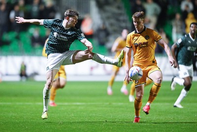 061026 - Newport County v Plymouth Argyle - EFL Trophy - Ged Garner of Newport County is challenged by Jack Mackenzie of Plymouth