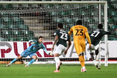 061026 - Newport County v Plymouth Argyle - EFL Trophy - Shaun MacDonald of Newport County saves the penalty from Aribim Pepple of Plymouth to keep the score level