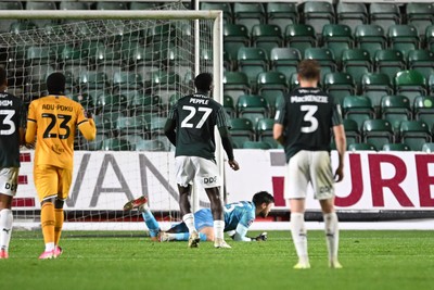 061026 - Newport County v Plymouth Argyle - EFL Trophy - Shaun MacDonald of Newport County saves the penalty from Aribim Pepple of Plymouth to keep the score level
