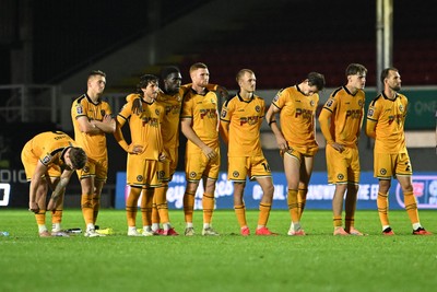 061026 - Newport County v Plymouth Argyle - EFL Trophy - Newport huddle during the penalty shootout