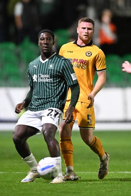061026 - Newport County v Plymouth Argyle - EFL Trophy - Lee Jenkins of Newport County is challenged by Aribim Pepple of Plymouth