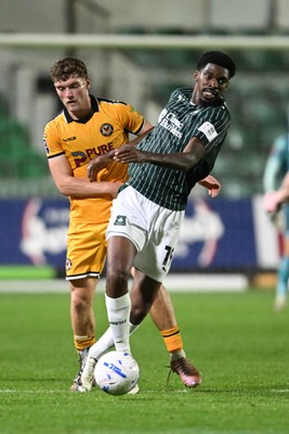 061026 - Newport County v Plymouth Argyle - EFL Trophy - Cameron Evans of Newport County is challenged by Tyreeq Bakinson of Plymouth