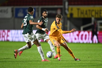 061026 - Newport County v Plymouth Argyle - EFL Trophy - Harrison Biggins of Newport County is challenged by Bradley Ibrahim of Plymouth