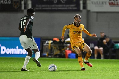 061026 - Newport County v Plymouth Argyle - EFL Trophy - Christian Doidge of Newport County is challenged by Tyreeq Bakinson of Plymouth
