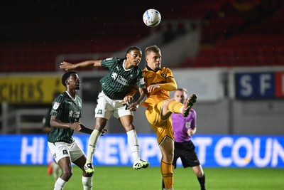 061026 - Newport County v Plymouth Argyle - EFL Trophy - Cole Jarvis of Newport County is challenged by Caleb Roberts of Plymouth