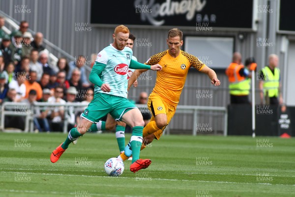 170819 Newport County vs Plymouth Argyle - Sky Bet League 2 - Mickey Demetriou of Newport County holds up Ryan Taylor of Plymouth Argyle