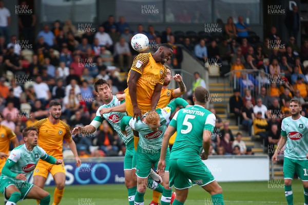 170819 Newport County vs Plymouth Argyle - Sky Bet League 2 - Jamille Matt of Newport County outjumps the Plymouth Argyle defence