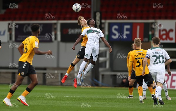 310821 - Newport County v Plymouth Argyle - Papa Johns Trophy - Jake Cain of Newport County and Angel Wariuh of Plymouth