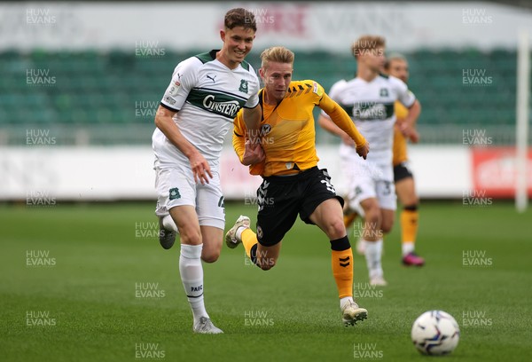 310821 - Newport County v Plymouth Argyle - Papa Johns Trophy - Ollie Cooper of Newport County is challenged by Oliver Tomlinson of Plymouth