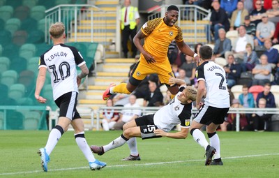 070919 - Newport County v Port Vale, SkyBet League 2 - Jamille Matt of Newport County collides with Nathan Smith of Port Vale as he is brought down and awarded a penalty
