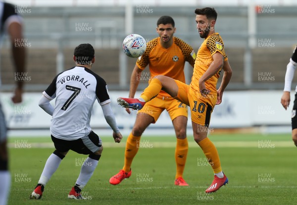 070919 - Newport County v Port Vale, SkyBet League 2 - Josh Sheehan of Newport County plays the ball past David Worrall of Port Vale